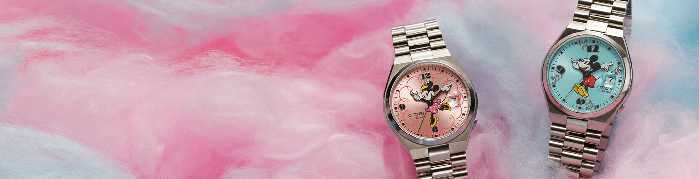 Image of TSUYOSA Mickey Mouse and TSUYOSA Minnie Mouse watch models on a cotton candy background