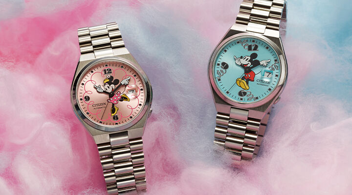 Image of TSUYOSA Mickey Mouse and TSUYOSA Minnie Mouse watch models on a cotton candy background