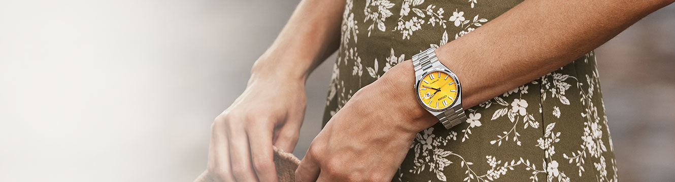 Image of a woman wearing boyfriend style TSUYOSA watch model NJ0150-56Z