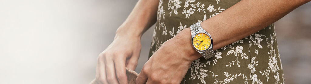 Image of a woman wearing boyfriend style TSUYOSA watch model NJ0150-56Z