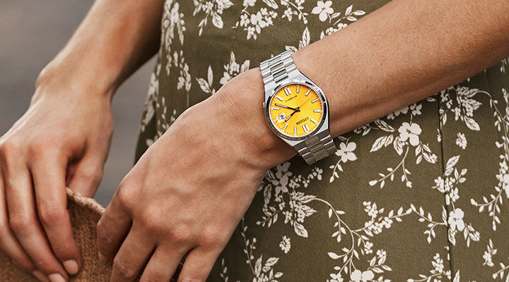 Image of a woman wearing boyfriend style TSUYOSA watch model NJ0150-56Z